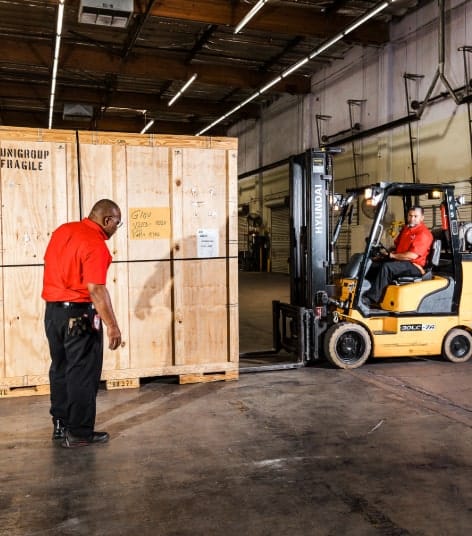 Forklift Picking Up Boxes