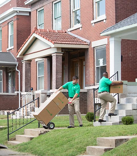 Mayflower Workers Moving Boxes