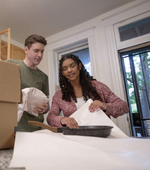 Couple Packing For A Move