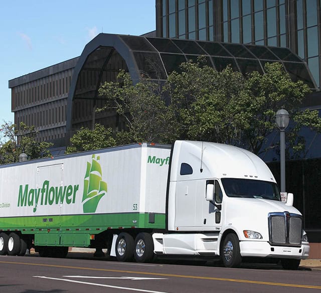 Mayflower Semi in Front of Office Building